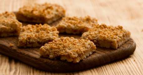 homemade apple pie on wooden background close up with copy space