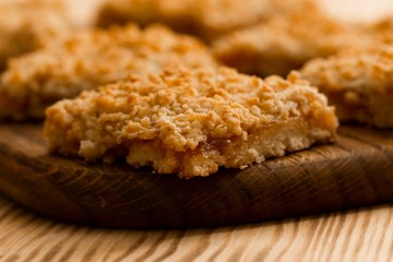homemade apple pie on wooden background close up with copy space