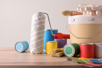 Table with painting tools for home white wall background detail