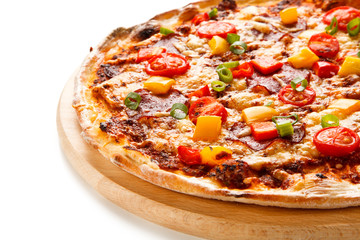 Pizza with ham and vegetables on white background