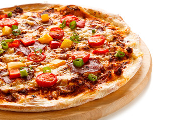Pizza with ham and vegetables on white background