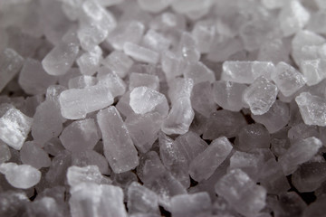 Fototapeta na wymiar Crystal of sea salt. Macro close up background.
