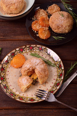 Steamed buns from cottage cheese dough with apricots in bread crumbs and nuts