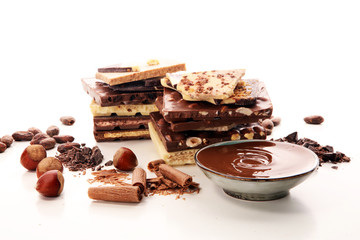 Chocolate bars on table with chocolate tower.