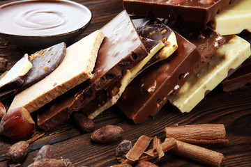Chocolate bars on table with chocolate tower.