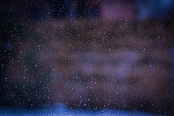 beautiful drops on the glass in the park background