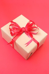 Brown gift box on red art paper