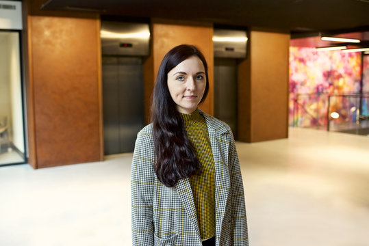 Portrait of a white businesswoman in a contemporary office