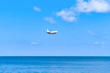 Plane is landing over water