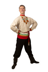 Attractive russian guy dancing in folk costume isolated on white