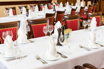 Cutlery on the tables in the restaurant.