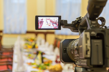 Video shooting at a restaurant at a Banquet. Camcorder with LCD display.
