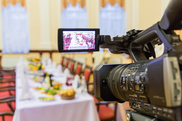 Video shooting at a restaurant at a Banquet. Camcorder with LCD display.