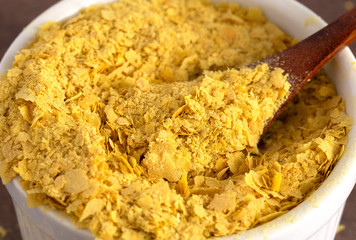 Flakes of Yellow Nutritional Yeast a Cheese Substitute and Seasoning for Vegan Diets