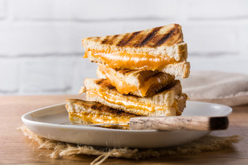 Grilled cheese sandwich on wooden table

