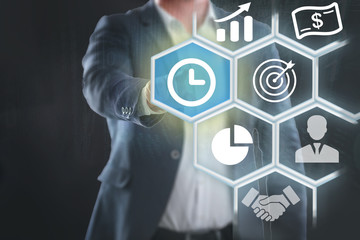 hand pushing button on a touch screen interface with time icon