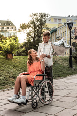 Cheerful longhaired girl talking to her partner