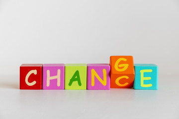 colorful wooden blocks toys with word change, business concept