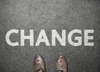 businessman shoes step to word change on road, business concept