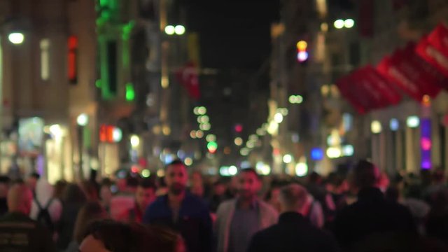 People walking on Istanbul street, Turkey. Blurred slow motion dolly shot