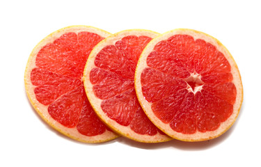 Fototapeta na wymiar Pink ripe grapefruit slice on white isolated background. Half and slice of grapefruit isolated on white.