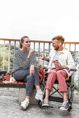 Kind girl listening to her invalid partner