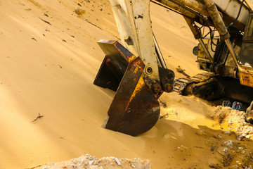  huge excavator bucket digs sand in  sand quarry mining