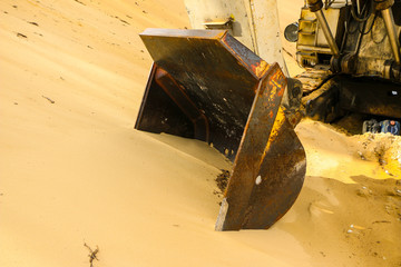  huge excavator bucket digs sand in  sand quarry mining