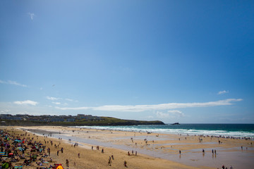 Fistral Beach in Newquay in England UK over a bright blue background