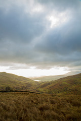 Fototapeta na wymiar Chasing clouds and cloudscape through sunrise in Lake District England UK