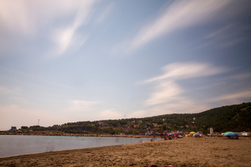 Sandy beach sunset and moving clouds long exposure test 22