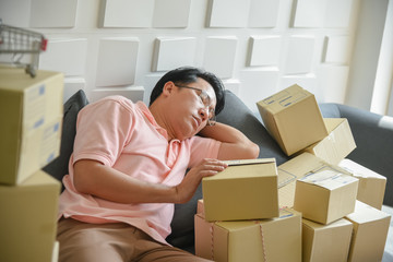 Asian men are falling asleep Because to tired of handling the order-based goods from online customers, which there are many, to SME concept.