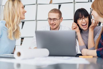 Group of young business people enjoying a joke