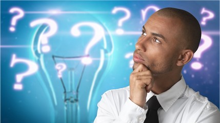 Thoughtful businessman portrait on background