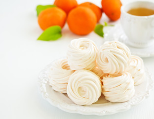 Delicious homemade marshmallows and oranges with spices.