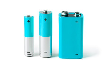 Blue AAA, AA and PP3 batteries, isolated on white background