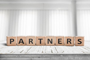 Partners sign on a desk in a bright office
