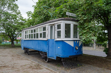 Fototapeta na wymiar Old tram. One of the first. retro transport. Electric transport. The car of the former electric tram, which once existed in Vinnitsa (Ukraine, Eastern Europe). Monument tram.