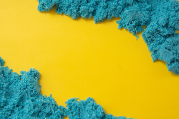 Bluekinetic sand texture with copy space. Creativity, education and play games for children. Close...