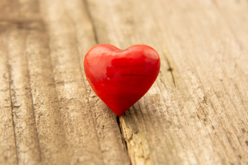 Two red hearts on wooden background, close-up, Valentine's day, celebrating love.