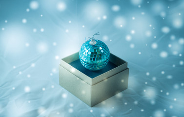 Christmas tree toy in the form of a disco ball in a box
