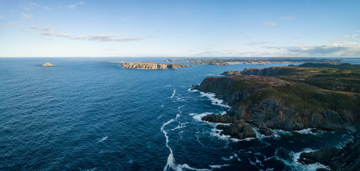 Aerial view of a rocky Atlantic Ocean Coast during a cloudy sunset. Taken in Twillingate, Newfoundland, Canada. © edb3_16