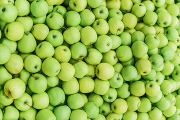 Background of green apples on sale at the local market. Green apple Raw fruit and vegetable backgrounds overhead perspective