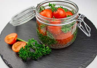 A variety of canned products in glass jars - tomatoes, cucumbers, Brussels sprouts, broccoli. Preservation of vegetables and fruits. canning. Preservation of the harvest. isolate