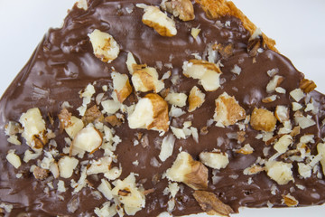 Chocolate toast, nuts on a stone background. Breakfast with toast chocolate, breakfast concept. sandwich with chocolate and nuts. view from above