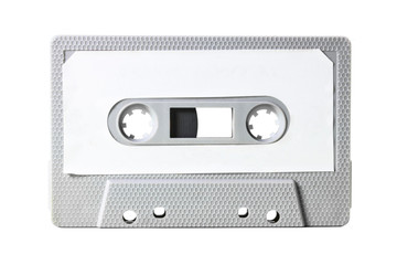 Obraz premium An old vintage cassette tape from the 1980s (obsolete music technology). Grey hexagon grid plastic body, white empty label.