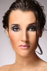 Portrait of young beautiful woman with smoky eye make-up