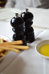 pouring olive oil in a pan