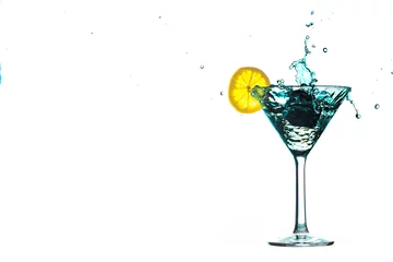 Foto op Plexiglas Blue cocktail water drink splash in the glass with lemon Isolated on white © Sergey Egorov