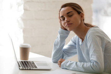 Tired woman sitting with closed eyes half asleep at workplace, lazy student, businesswoman...